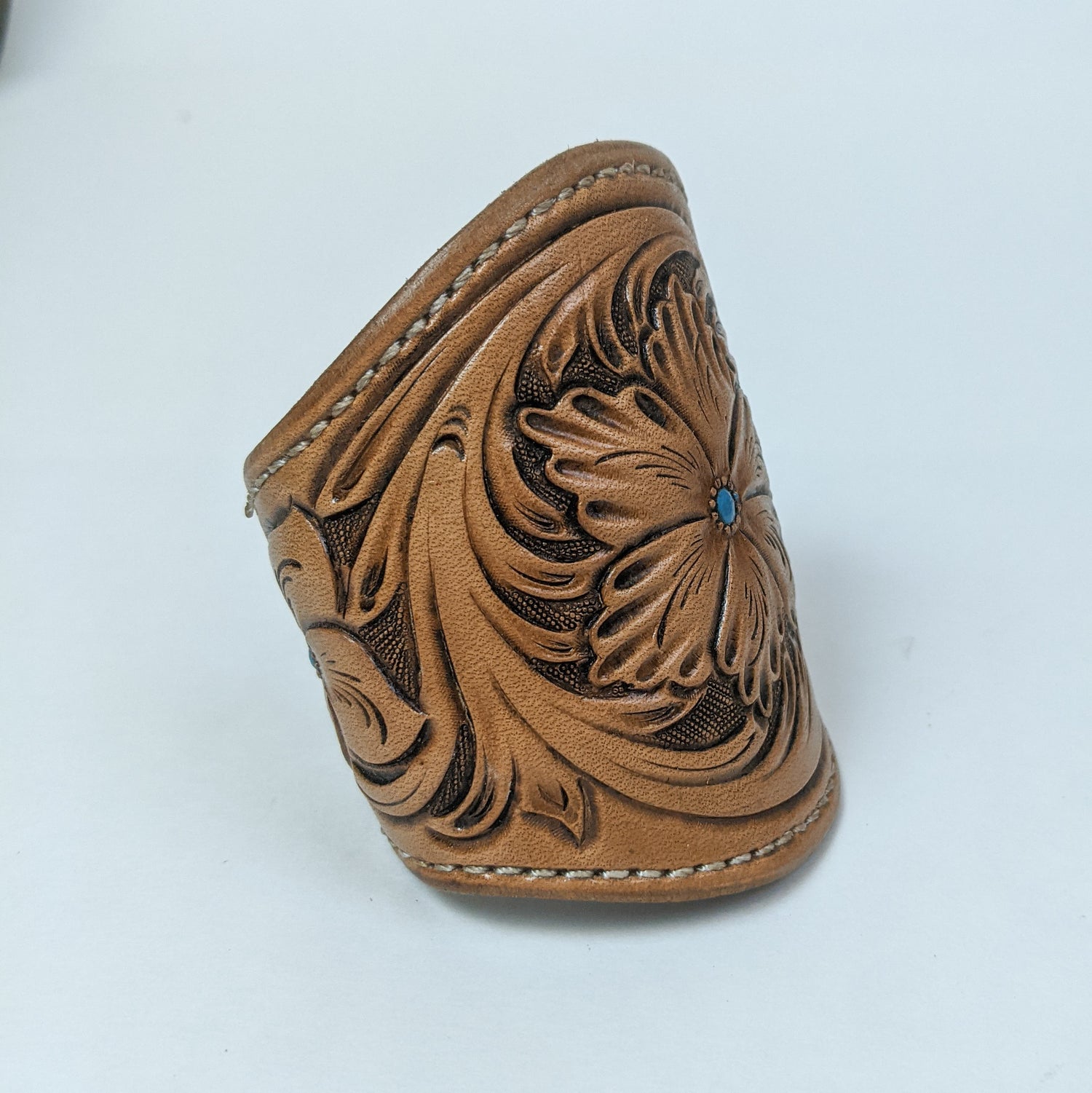 leather cuff made from brown tooled leather. leather bracelet wristband