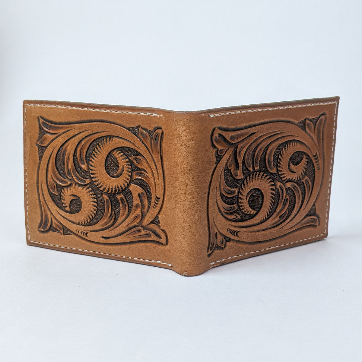 Handmade leather bifold wallet with western tooled pattern durable leather to last a several years