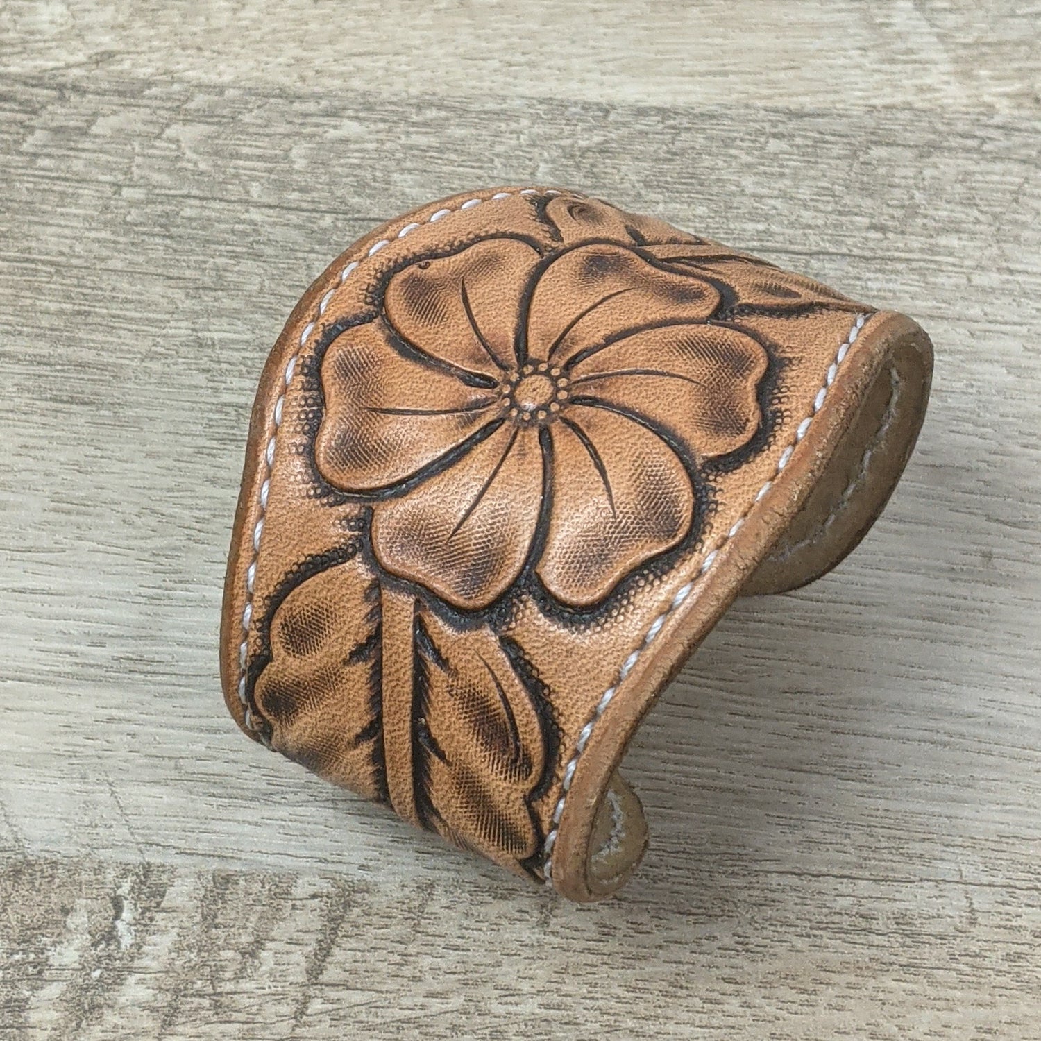 leather cuff made from brown tooled leather. leather bracelet wristband