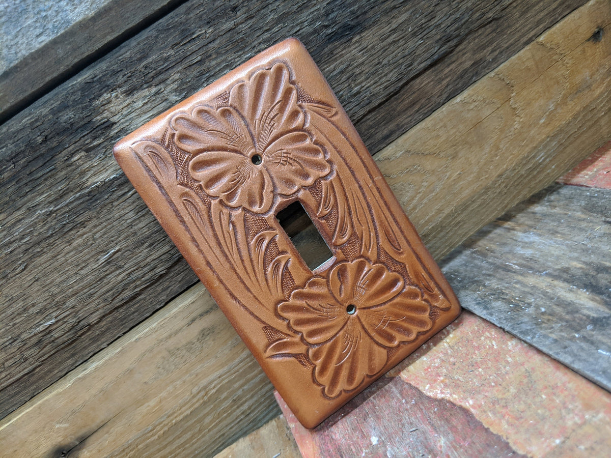 Switch plate cover made on leather and tooled floral pattern