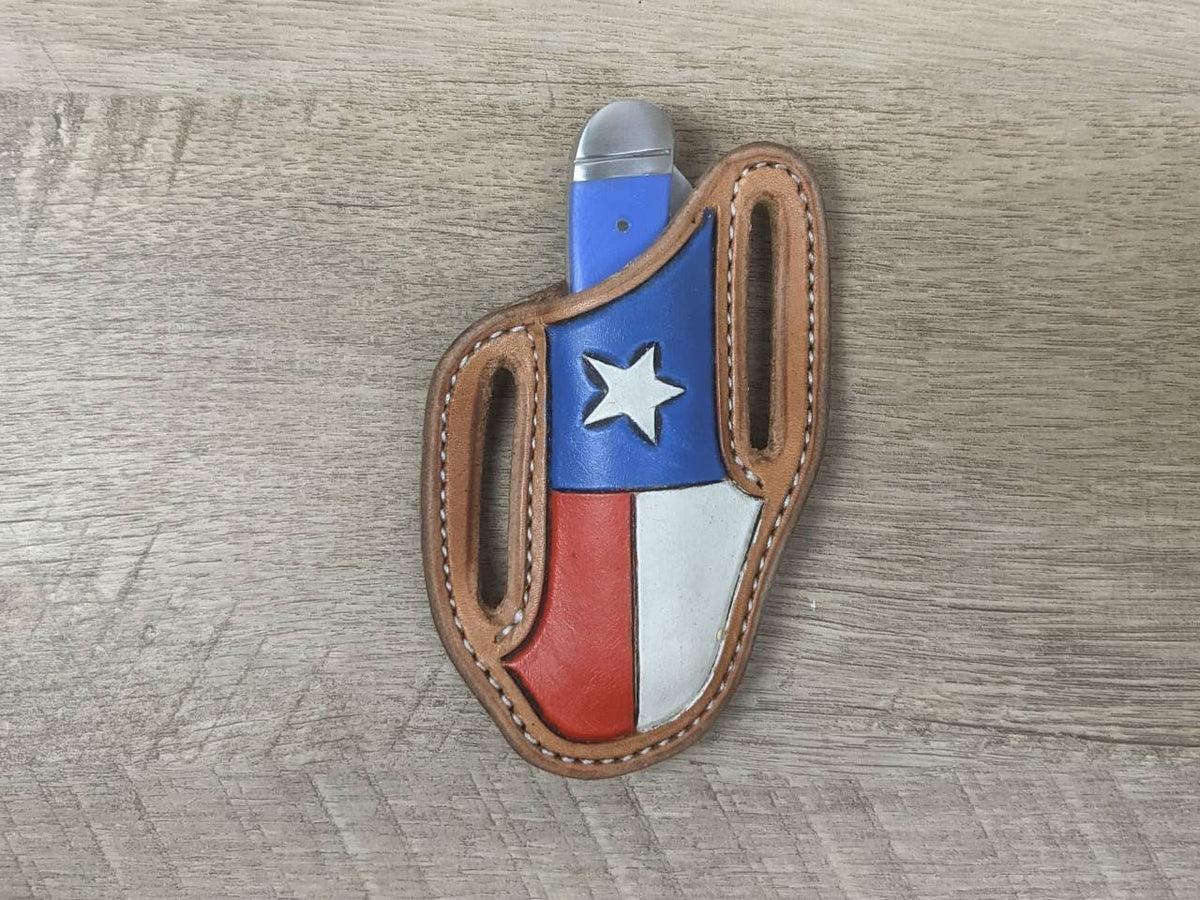 Blue micarta handled Rough Rider Trapper knife with matching Texas flag Leather Pancake Style sheath