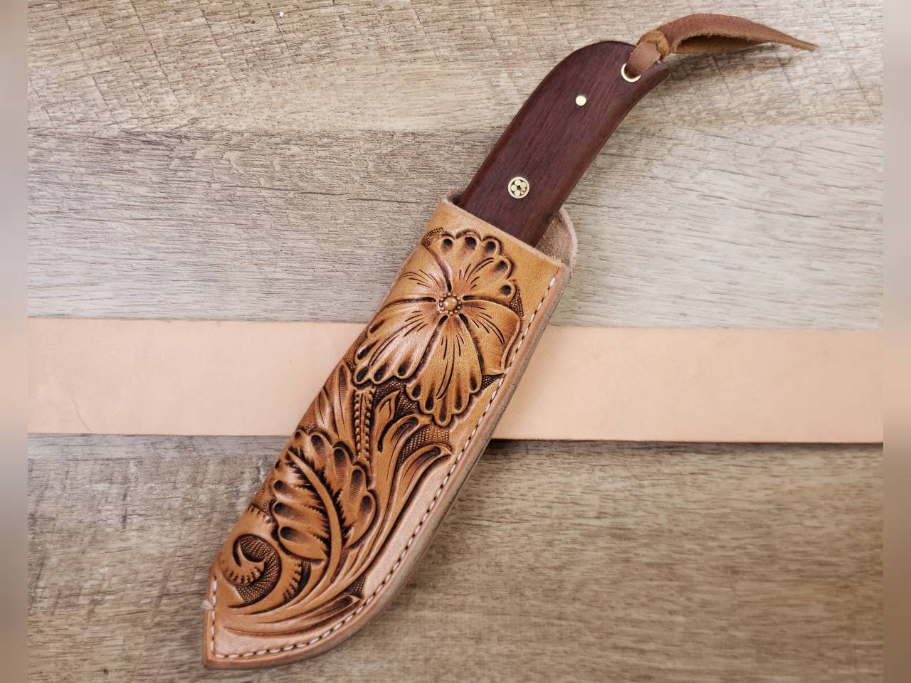 1095 forged hunting knife with a tooled leather angled sheath