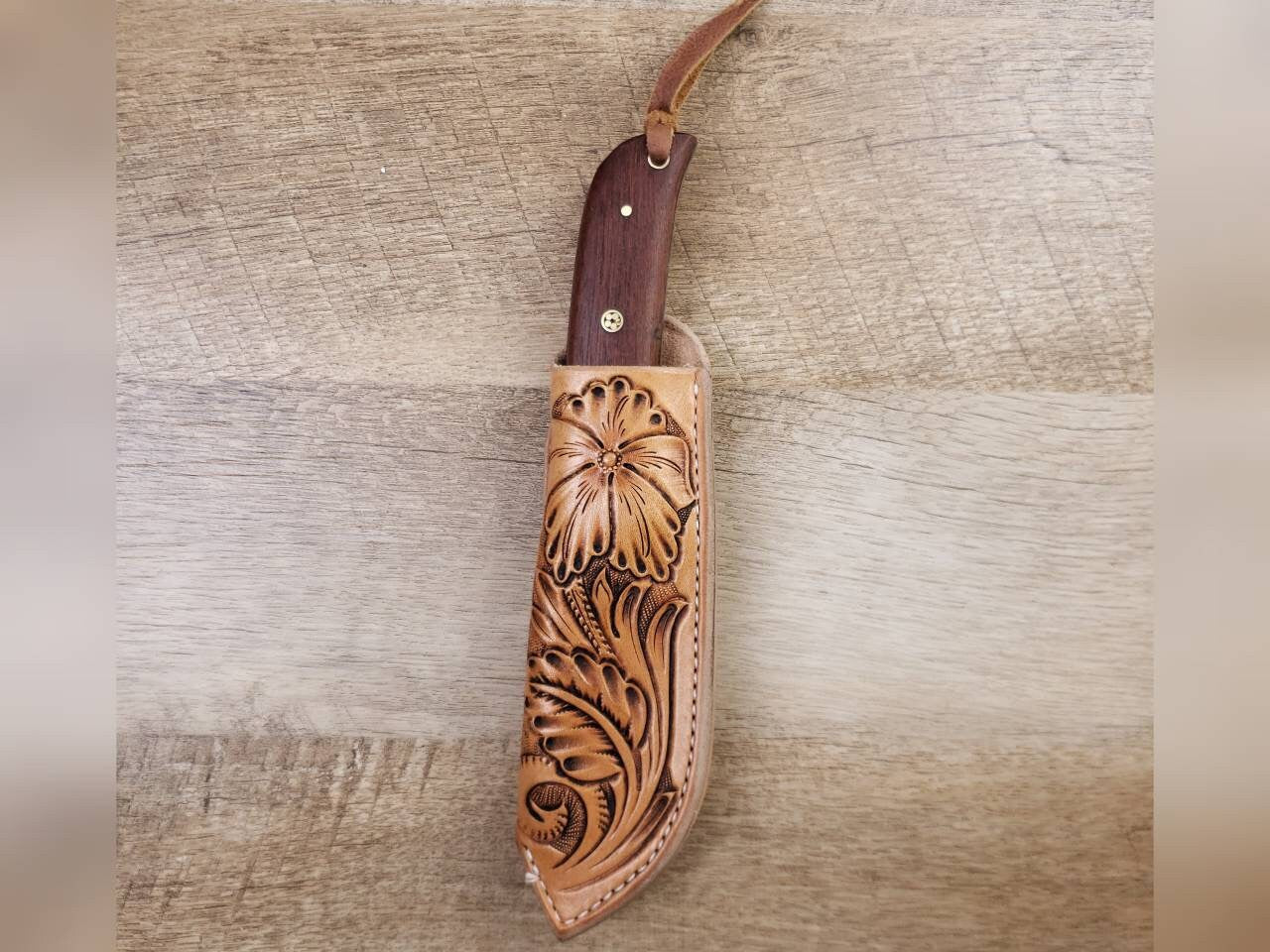 1095 forged hunting knife with a tooled leather angled sheath