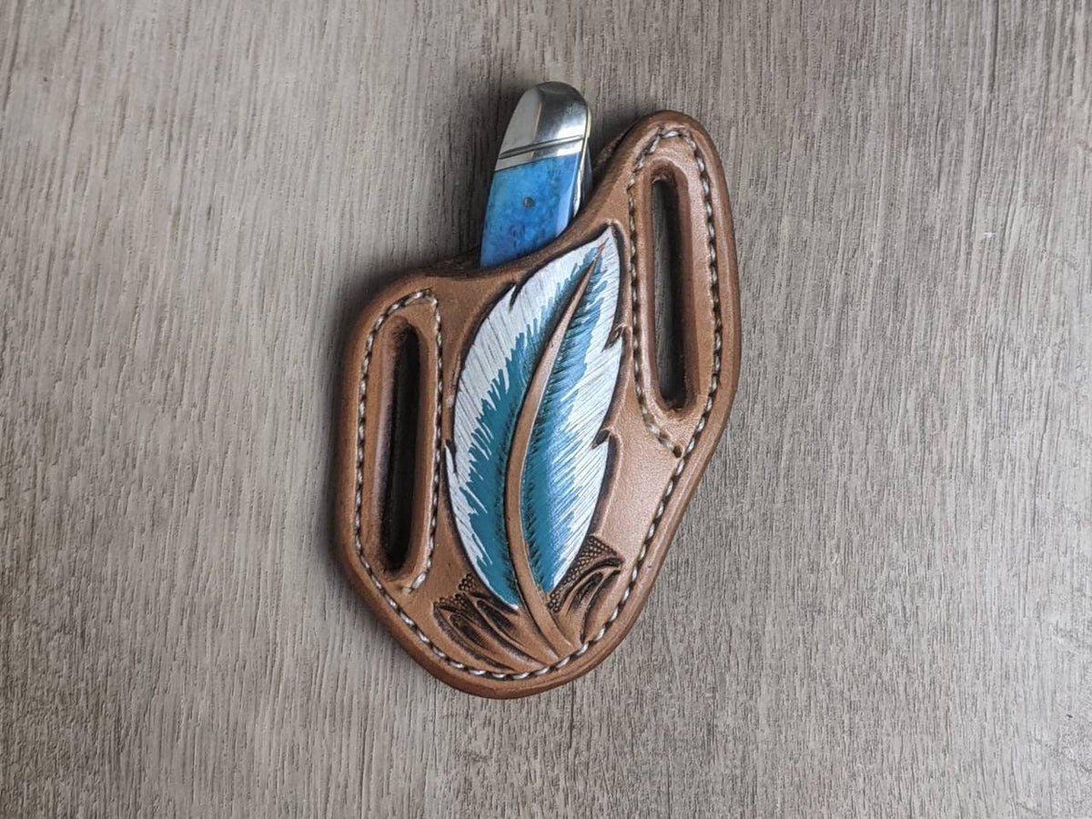 Turquoise bone handled Rough Rider Trapper knife with matching painted feather Leather Pancake Style sheath