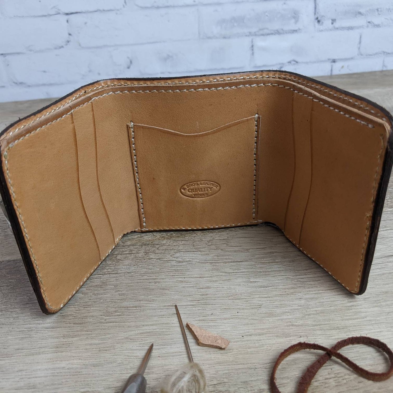 Handmade men's all leather trifold wallet with flower tooled design