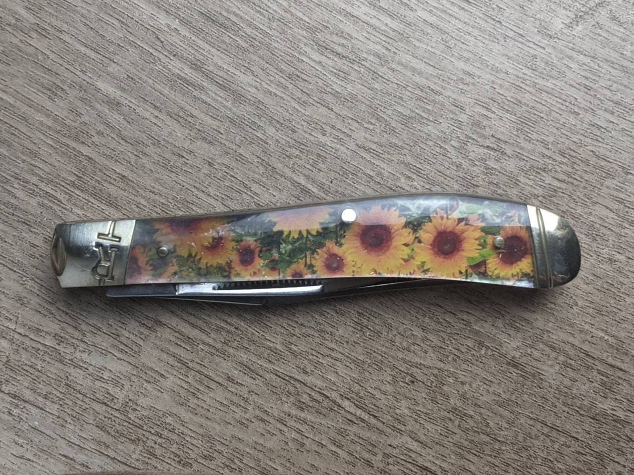 Sunflower epoxy handle Rough Rider Trapper knife with matching painted sunflower Leather Pancake Style sheath
