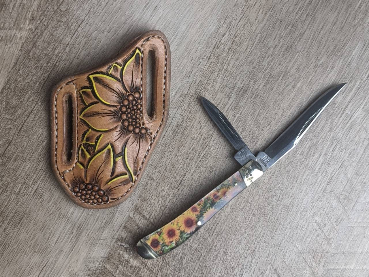 Sunflower epoxy handle Rough Rider Trapper knife with matching painted sunflower Leather Pancake Style sheath
