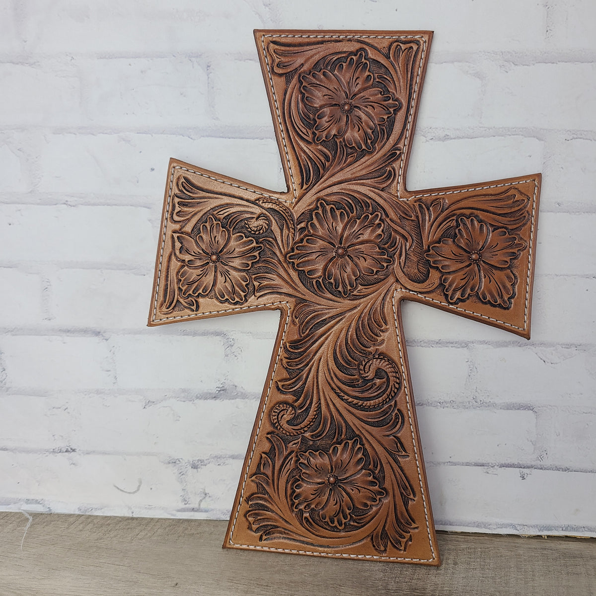 Wall hanging cross made from leather and floral carved