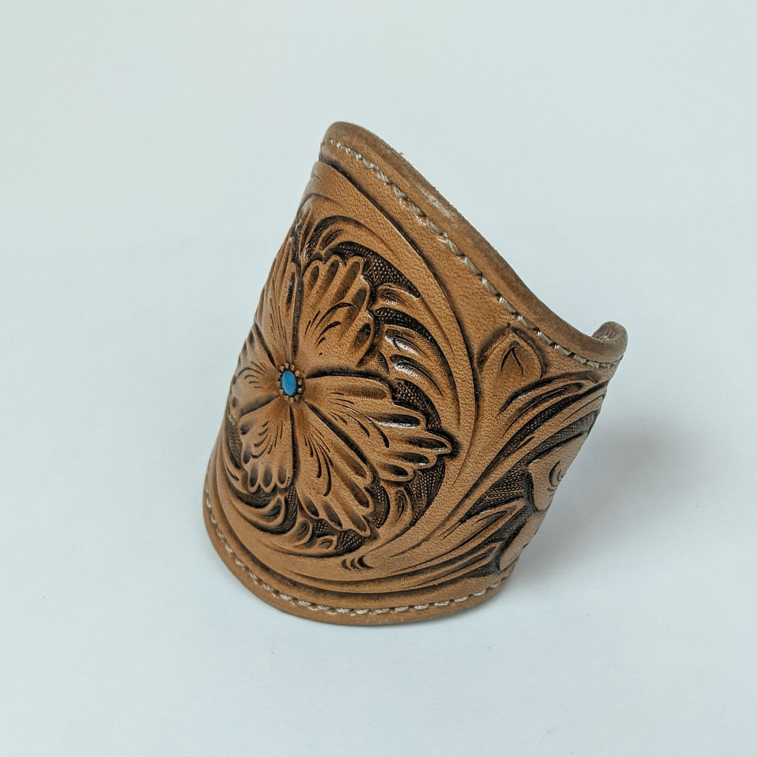 leather cuff made from brown tooled leather. leather bracelet wristband