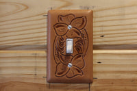 Switch plate cover made on leather and tooled floral pattern