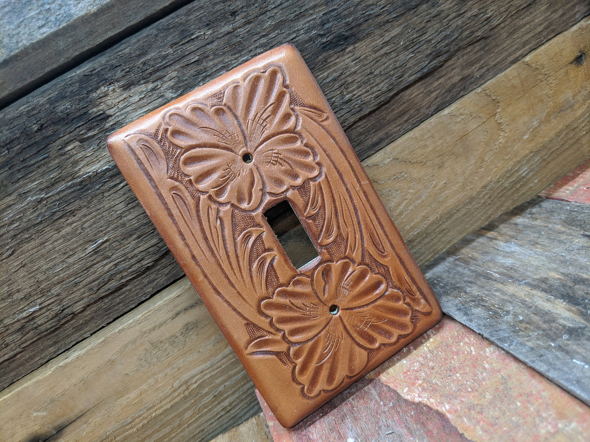 Switch plate cover made on leather and tooled floral pattern