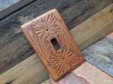 Switch plate cover made on leather and tooled floral pattern