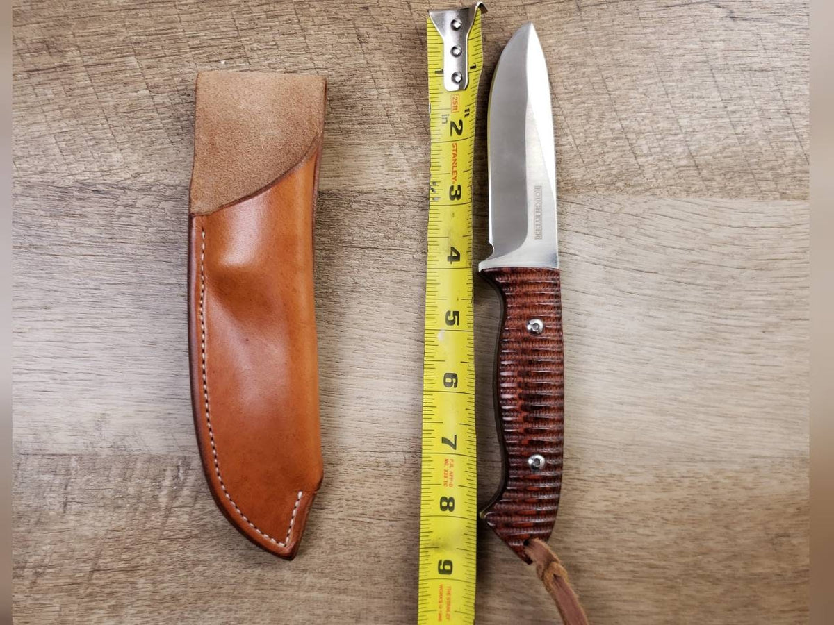 Rough rider hunting knife with a plain straight hang leather sheath