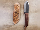 1095 forged hunting knife with a tooled leather angled sheath
