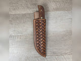 1095 forged hunting knife with a tooled basket weave leather straight hang sheath