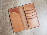 Tall leather roper wallet with tooled sunflower and cannabis leaf pattern