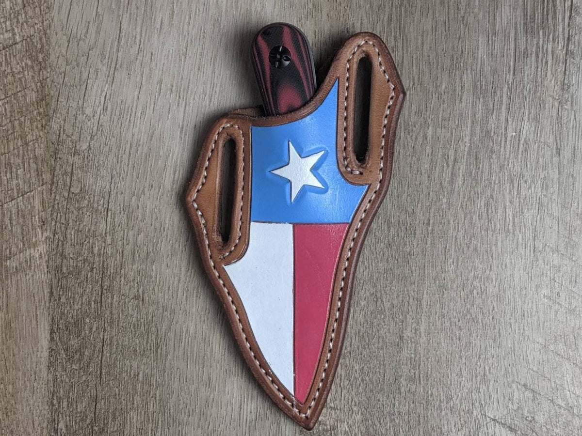 Rough Rider fixed blade knife with g-10 handle with a state of Texas leather pancake sheath