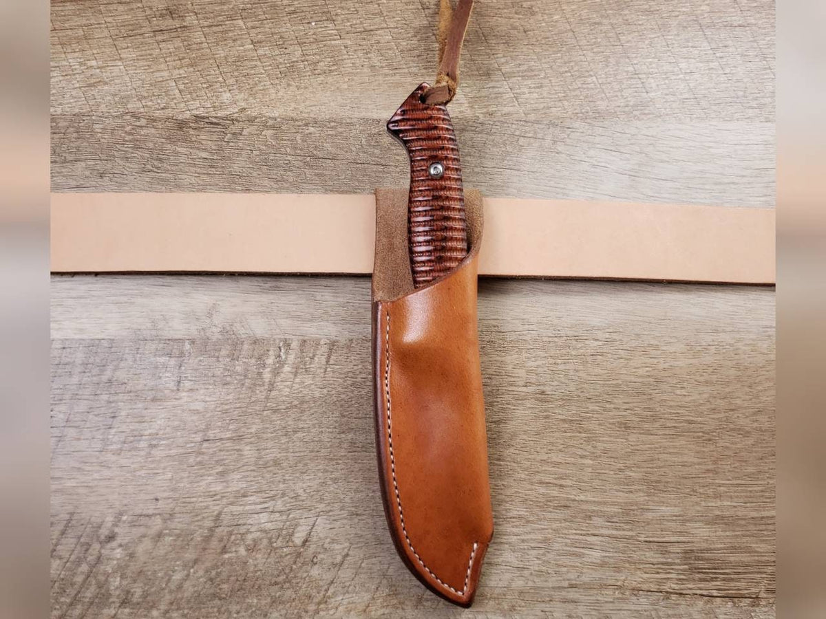Rough rider hunting knife with a plain straight hang leather sheath