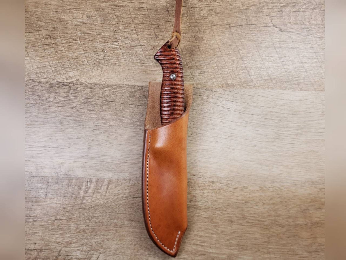 Rough rider hunting knife with a plain straight hang leather sheath
