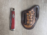Red bone handled Rough Rider Trapper knife with matching painted floral carved chocolate Leather Pancake Style sheath